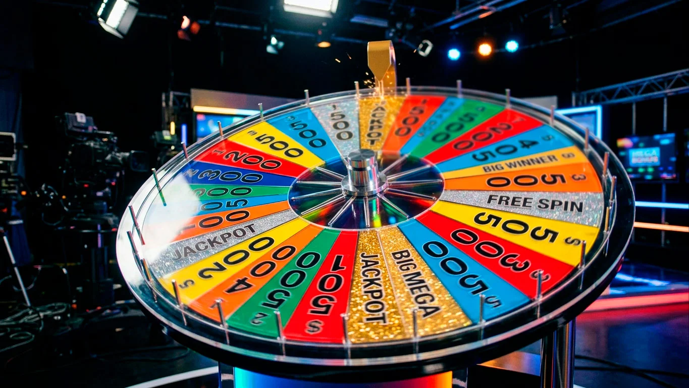 Close-up of a large spinning wheel game with numbered segments and bonus zones